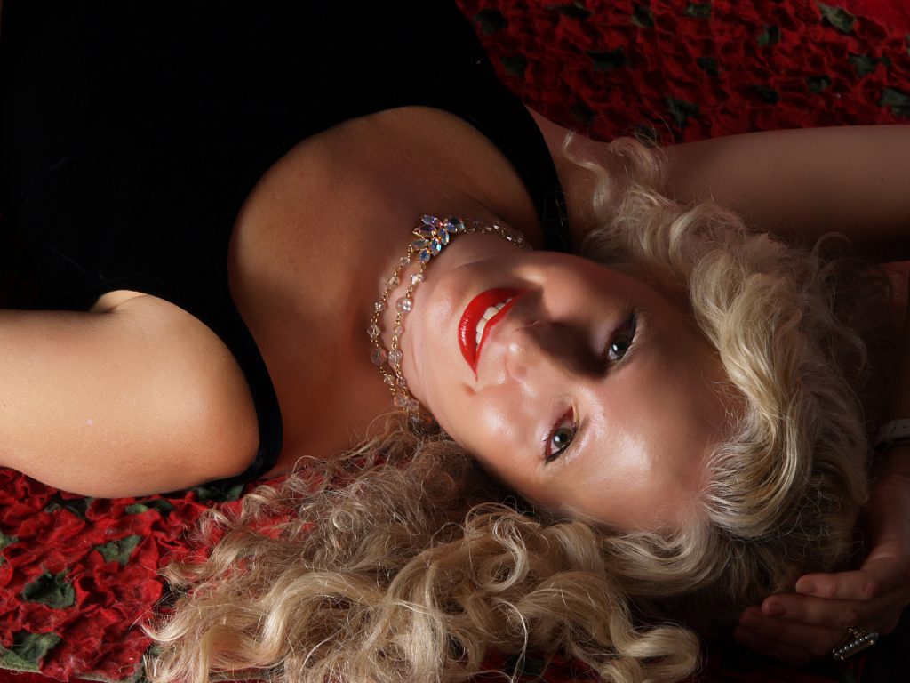 woman-on-bed-of-roses